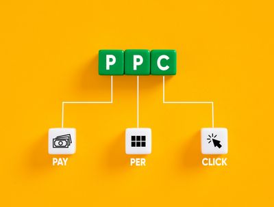 Green blocks with 'PPC" on them on a yellow background